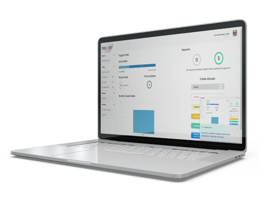 Laptop displaying Tragget dashboard for dump truck dispatching and job tracking